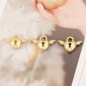 Three pieces of gold winged heart lock pendants in copper with 18K gold plating
