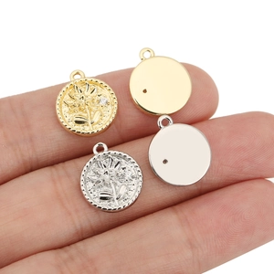 Macro shot of gold and silver vintage rose coin pendants for DIY jewelry making