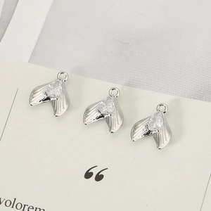 Three fishtail jewelry pendants with pear-cut zircon in polished 18k gold plating