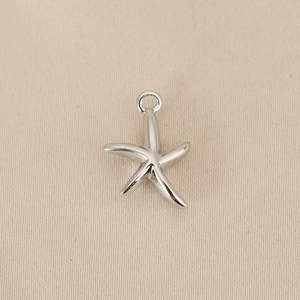 Polished silver starfish pendant with solid metal finish and small hanging ring loop