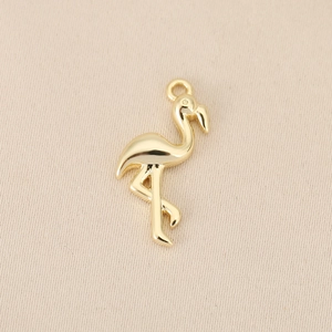 Detailed view of polished 18k gold plated flamingo pendant for jewelry making