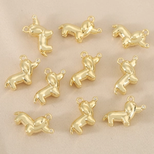 Golden dachshund dog pendant with shiny mirror polish and sparkling small crystal
