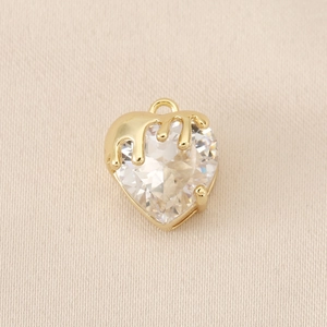 Macro detail of heart-shaped zircon pendant with 18K gold-plated lava fluid design