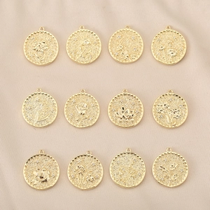Detailed macro of 12 copper 18K gold-plated floral pendants with micro zircon inlay