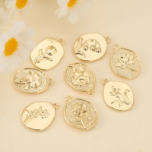 Set of 8 gold flower relief pendants in oval and teardrop shapes for jewelry making