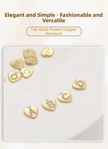 Detail view of heart-shaped 14K gold-plated copper charms with inlaid cubic zirconia letters