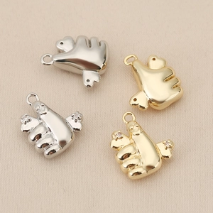 Polished 18K gold and silver thumb gesture bear pendants with cubic zirconia accents