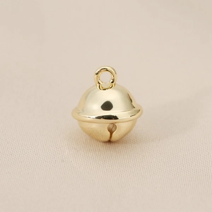 Close-up of polished 18K gold-plated bell pendant for DIY necklace making