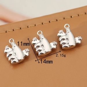 Three 18K silver-plated thumb up pendants with white zircons on brown leather backdrop
