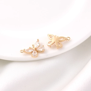 Macro shot of 18K gold-plated butterfly pendant with clear cubic zirconia for DIY jewelry