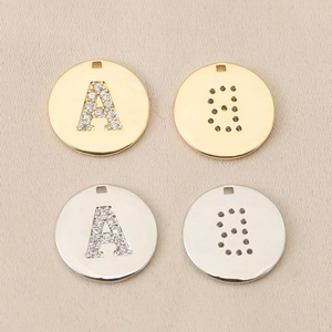 Detail of DIY alphabet charms with micro-pave cubic zirconia and high-shine plating