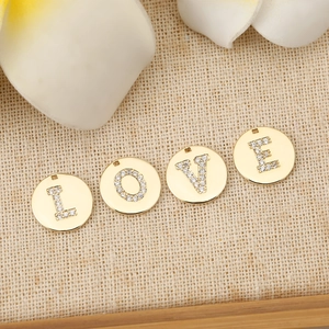 Golden round alphabet charms with sparkling cubic zirconia letters L-O-V-E for DIY jewelry
