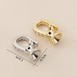 Macro detail of gold and silver jewelry clasps with cubic zirconia inlay for DIY crafts