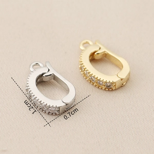 Detail of 1.2cm gold and silver jewelry clasp with micro-paved cubic zirconia stones