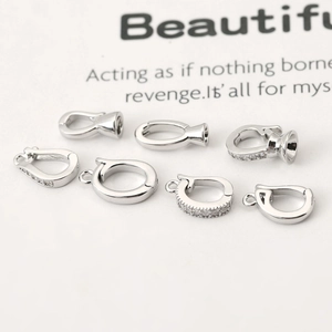 Close-up of silver plated pendant clasps with zircon inlay for DIY jewelry design