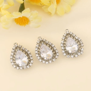Detailed view of teardrop pendant set with pear-cut cubic zirconia in silver finish