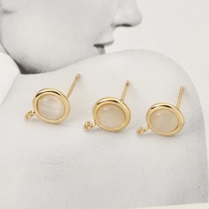 Macro view of 18k gold plated DIY earring studs with S925 hallmark and white stones