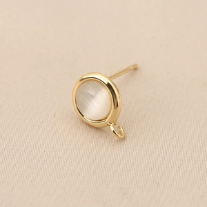 Close-up of 18k gold plated earring post with opal inlay and small hanging loop