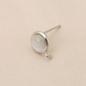 Macro detail of silver ear stud finding with hanging loop for DIY jewelry making