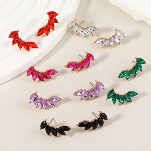 Detail showing colorful marquise-cut crystal wing earrings in various vibrant colors