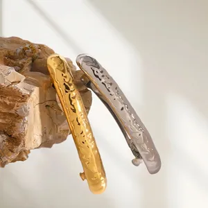 Minimalist stainless steel hair clips with hammered texture in gold and silver finishes