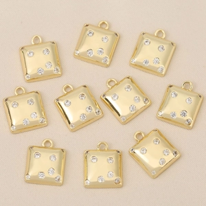Detail of cubic 18k gold plated charms with zircon inlay for DIY jewelry design