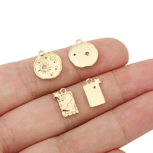 18k gold plated celestial pendants featuring sun, moon and star designs with zircon stones