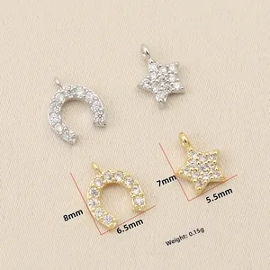 Detail showing 18k gold and silver horseshoe and star charms with zircon inlay size 8mm