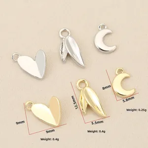 Detail of 18k gold heart, leaf, and moon charms with precise size and weight specs