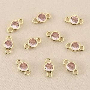 Macro view of 18k gold plated round pink zircon connectors for DIY jewelry making