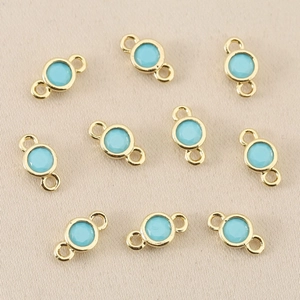 Close-up of light blue zircon connectors in 18k gold plating for DIY jewelry