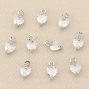 Macro shot of 18k gold plated heart pendants with cubic zirconia for DIY jewelry making