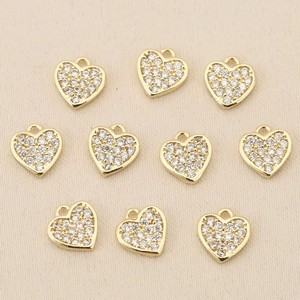 Macro view of 18k gold plated heart pendants with zircon pave for DIY jewelry making