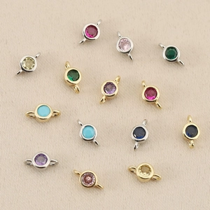 Detail of 18k gold-plated circular zircon connector charms for DIY bracelet making
