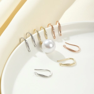 Macro detail of 18K gold plated CZ stone ear hooks for DIY jewelry in three metallic colors