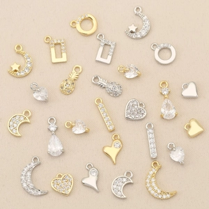 18k gold plated copper charm collection with heart moon star shapes and pavé cubic zirconia