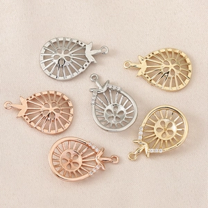 Colgantes de gota bañados en oro 18k con circonitas y diseño floral calado