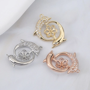 Three-color dolphin flower pendants with sparkling crystals in gold, silver, and rose gold