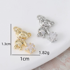 Pendentif ours en cuivre avec étoile en zircone cubique, finitions or et argent