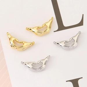 Polished 18K gold and silver heart-shaped gesture pendants for DIY jewelry making