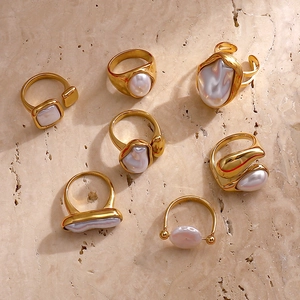Luxury 7-piece baroque pearl gold stainless steel ring set for women on beige marble