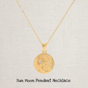 Golden stainless steel sun and moon pendant necklace with delicate zircon crystal accents