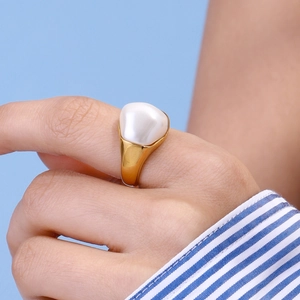 Baroque pearl ring in gold-plated stainless steel shown on a model's hand