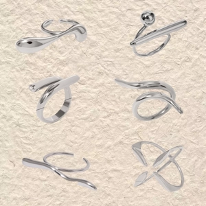 Juego de seis anillos minimalistas de acero inoxidable plateado con diseños fluidos