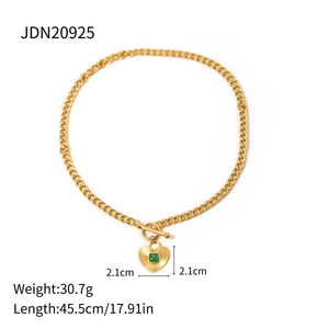 Gold heart pendant necklace with emerald green stone and toggle clasp chain