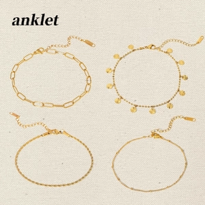 Set of four 18K gold plated stainless steel anklets with cross and link chain designs