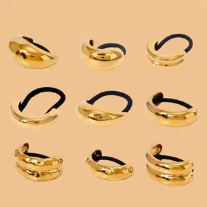 Collection of nine minimalist gold stainless steel hair rings with elastic bands for ponytails