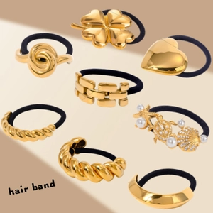 Set of 8 gold stainless steel hair bands featuring heart and starfish charms