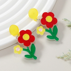Colorful floral drop earrings with red acrylic flowers and vibrant yellow petal accents