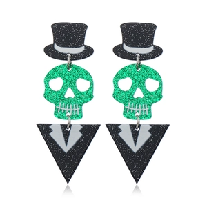 Halloween-Ohrringe mit grün glitzernden Totenköpfen und schwarzen Acryl-Zylinderhüten Design